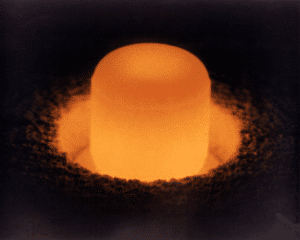 Plutonium-238 generating heat and light for a radioisotope thermoelectric generator